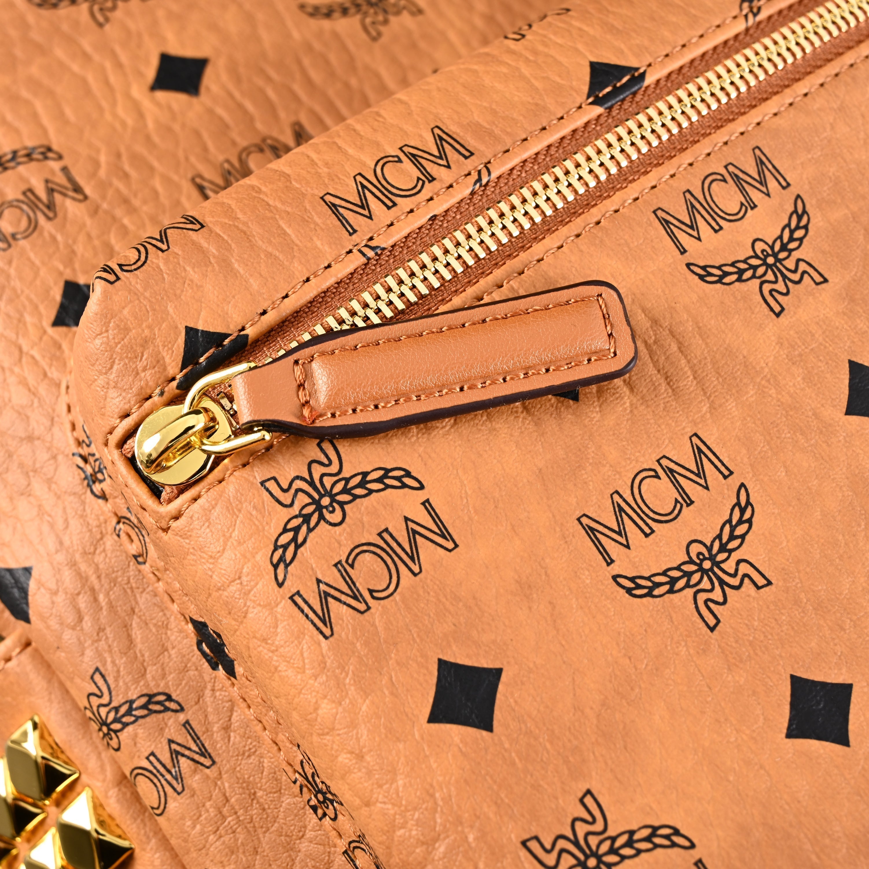 MCM Stark Visetos Medium Backpack – Cognac Monogram with Gold-Tone Studs